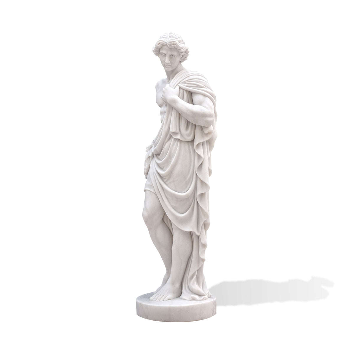 Three-quarter view of a classical marble male figure emphasizing the hand gathering fabric at the shoulder, layered folds across the waist and a bent knee emerging from the drapery. Bare feet rest on a round base against a white background.