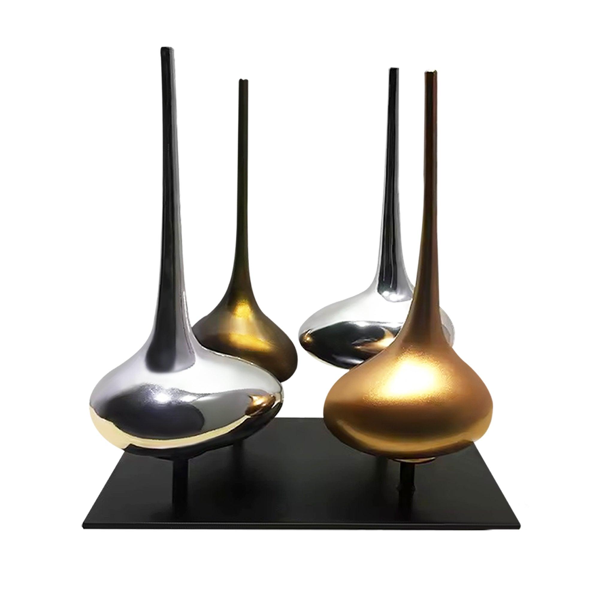 Modern metal flasks sculptures in silver and gold finishes, mounted on a black base