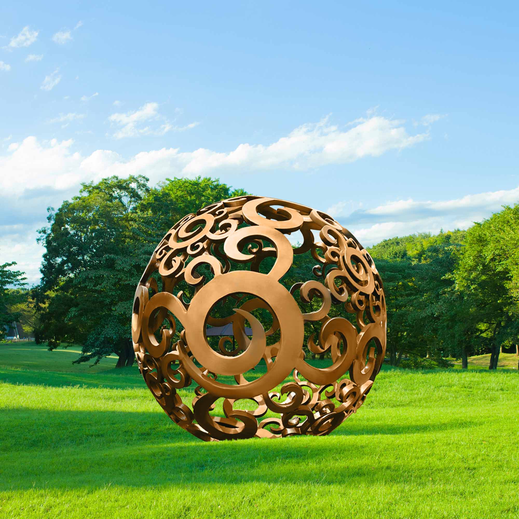 large metal sculptures hollow round ball on the grass