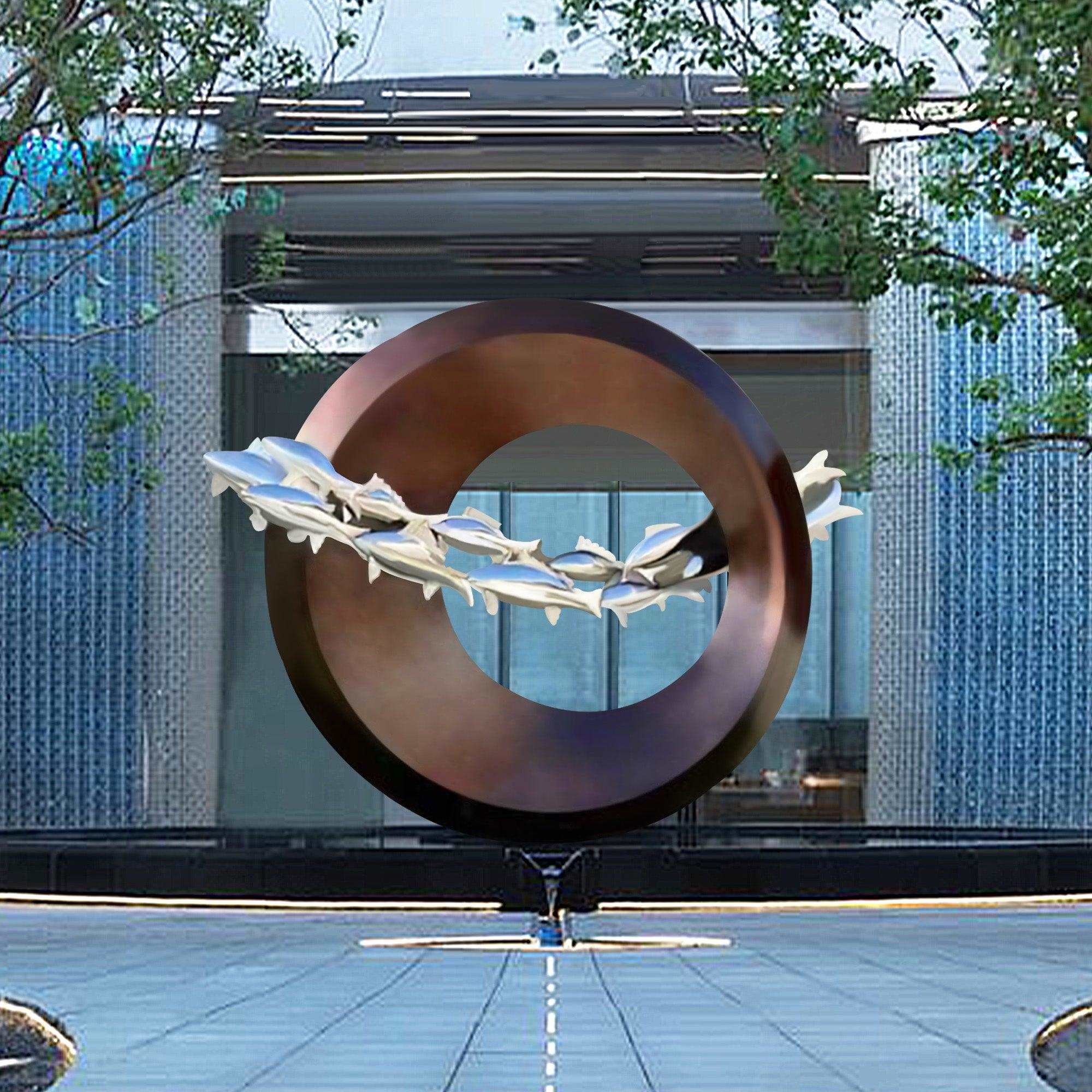 modern art of many fishes in a large metal circle garden sculpture