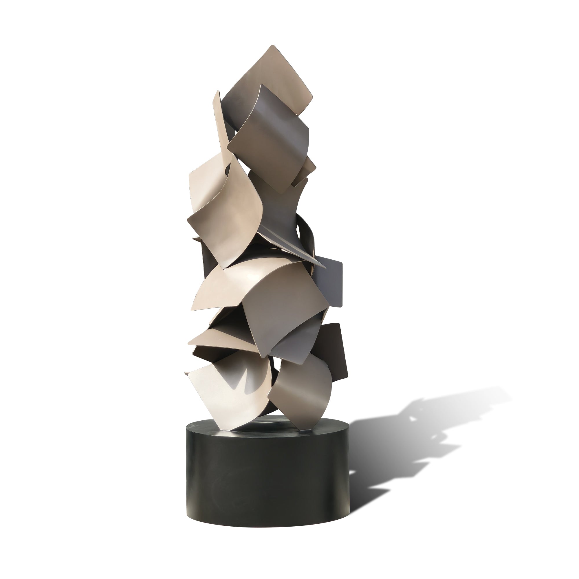 Modern sculpture with layered geometric shapes on a white background
