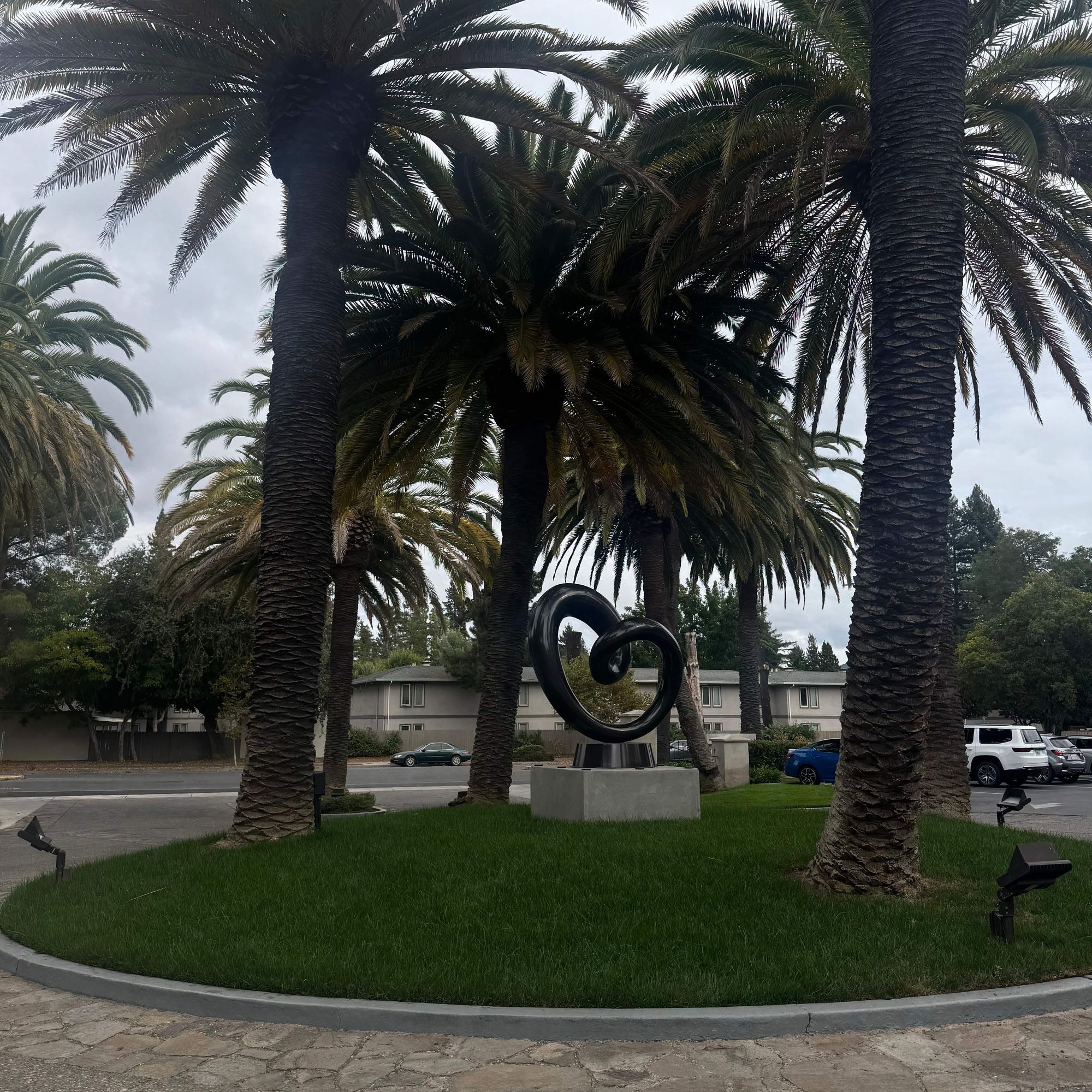 modern stainless steel heart loop sculpture installed at curio collection hilton napa valley hotel