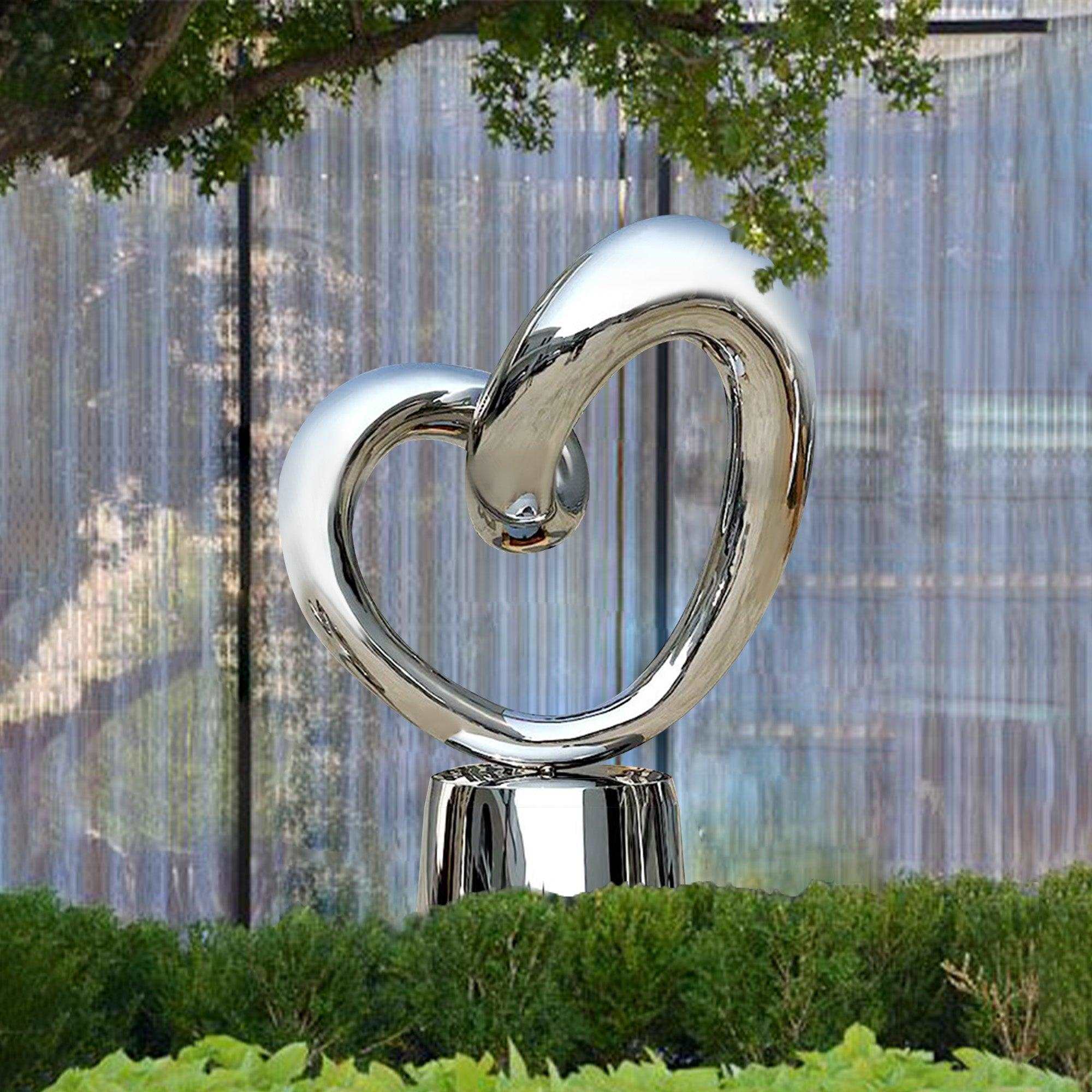 hollow circle metal mirror polish heart sculpture artwork in outdoor