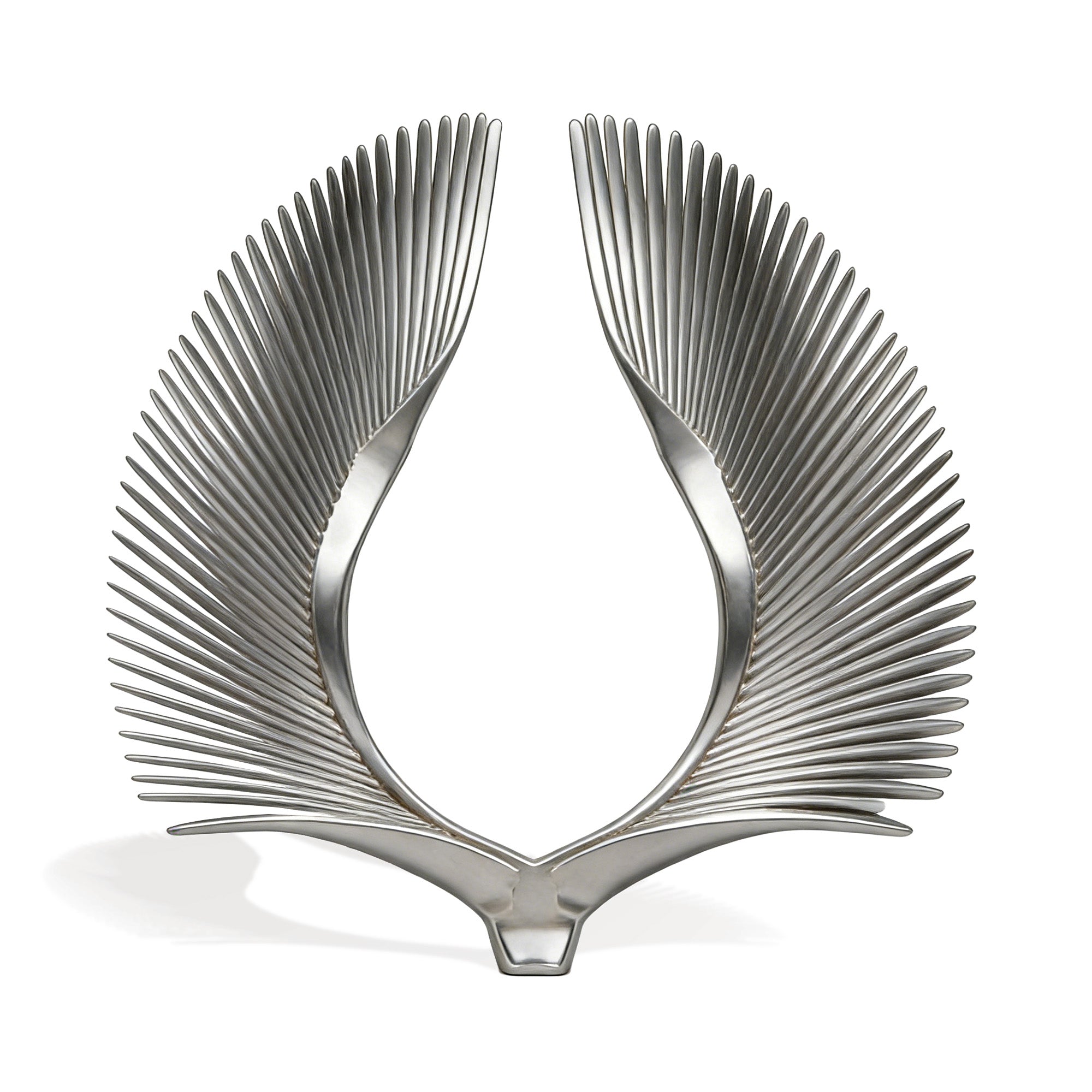 Metallic wing-like sculpture on a white background