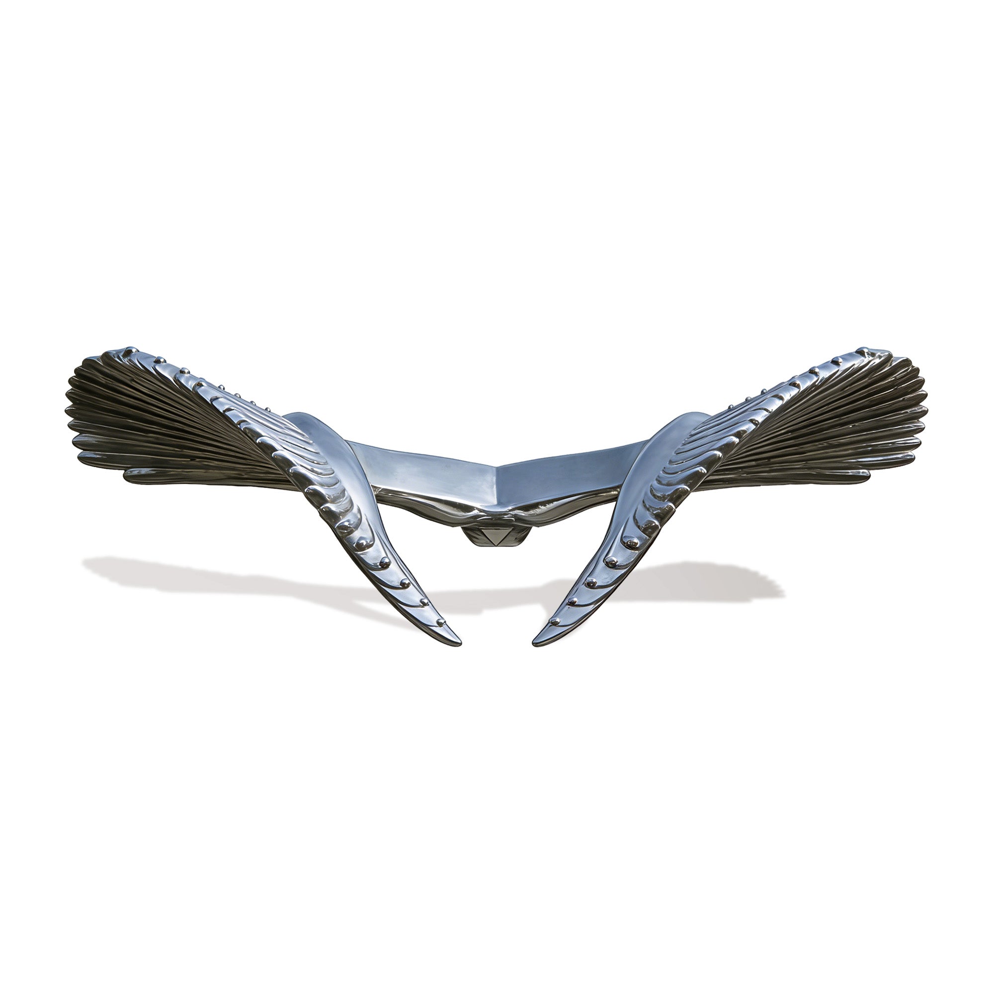 Metallic wing sculpture on a white background