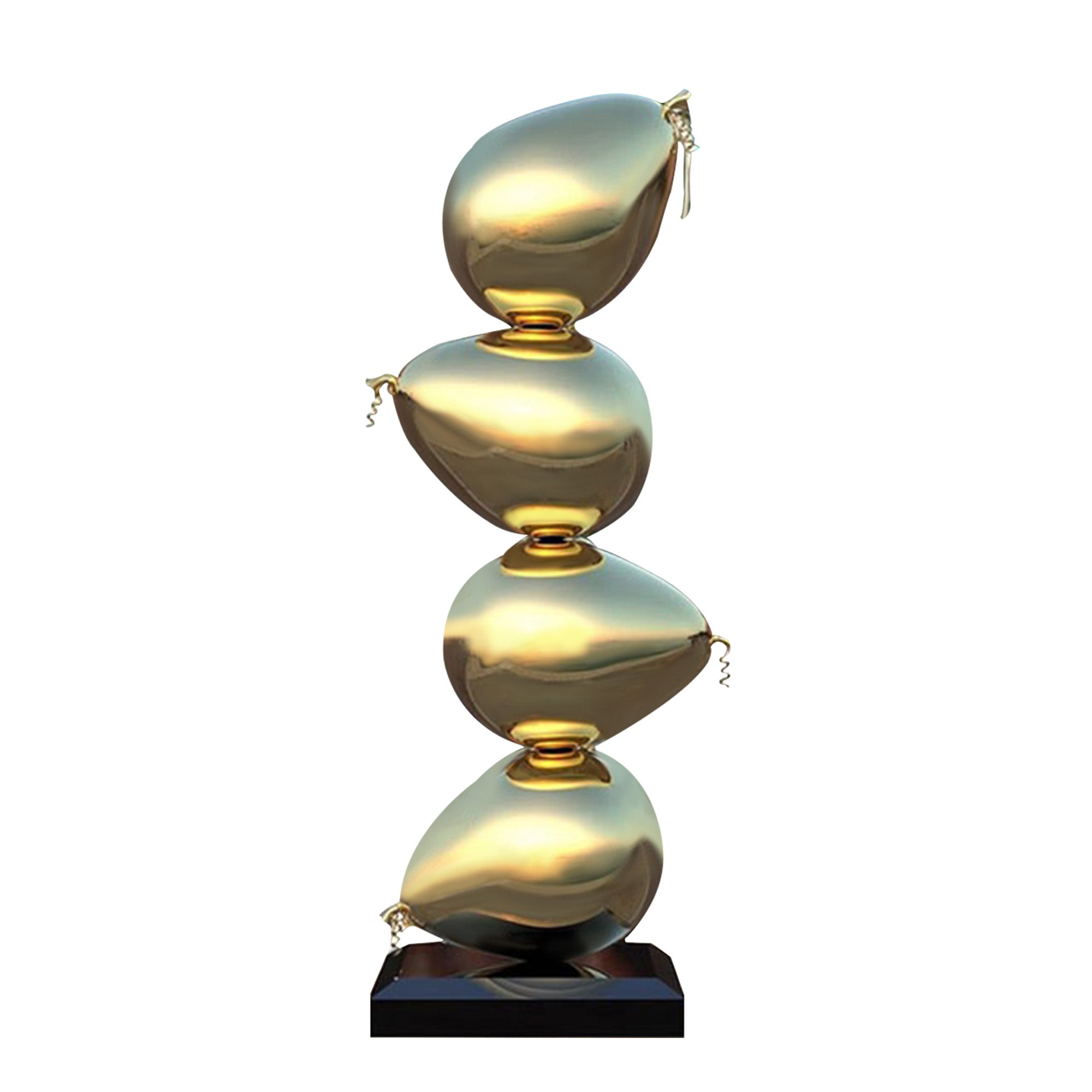 four gold stacked balloon stainless steel sculpture