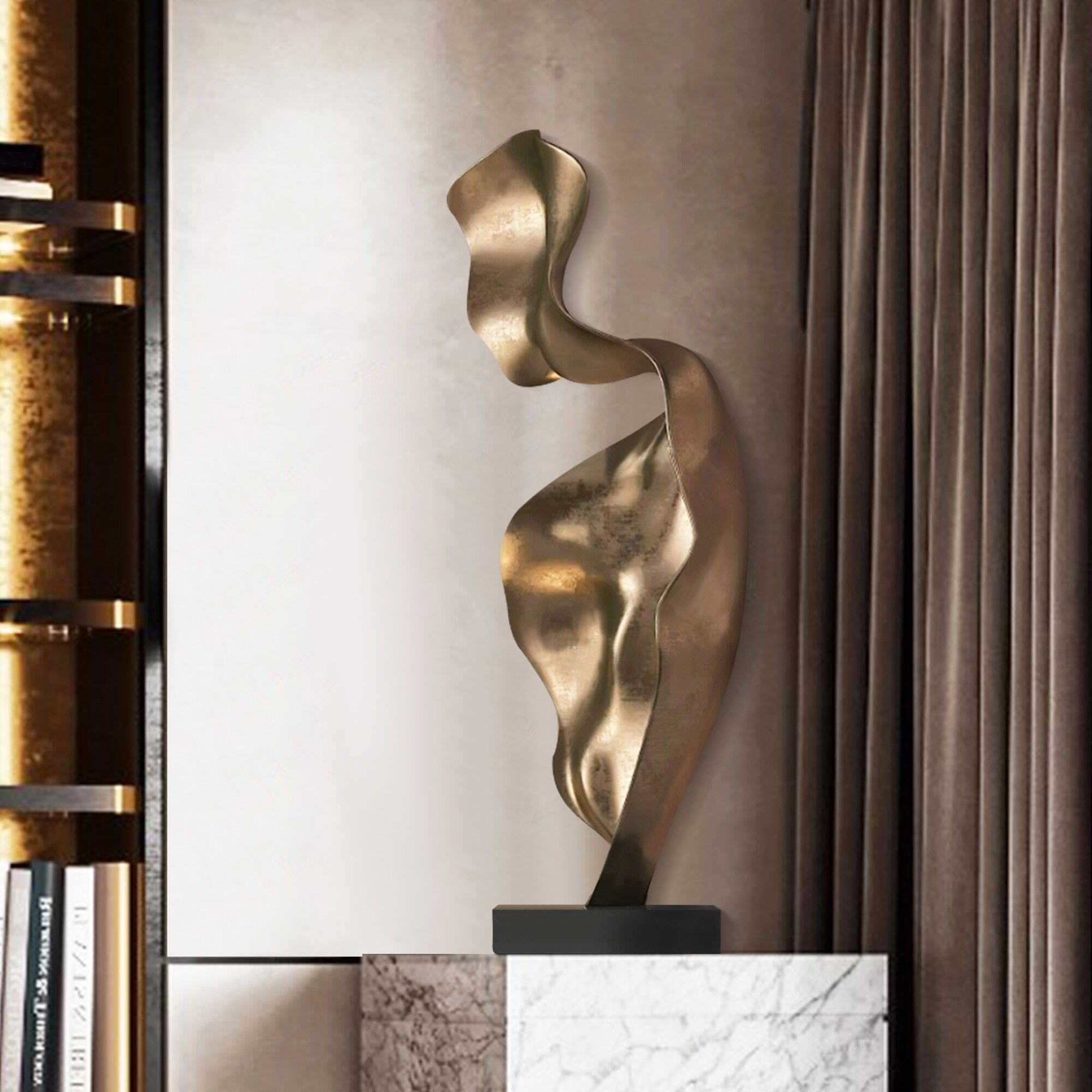 Modern abstract gold metal indoor sculpture with a fluid, twisting form, displayed in a luxurious setting.