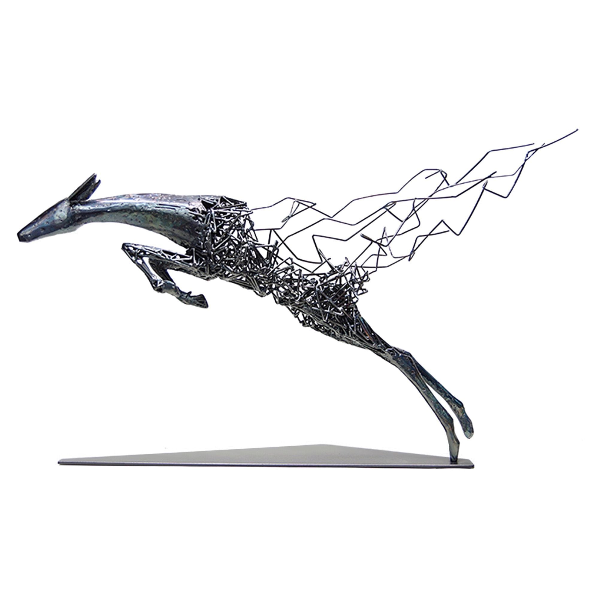 Abstract metal floor sculpture of a deer with fragmented design in glossy black and matte white