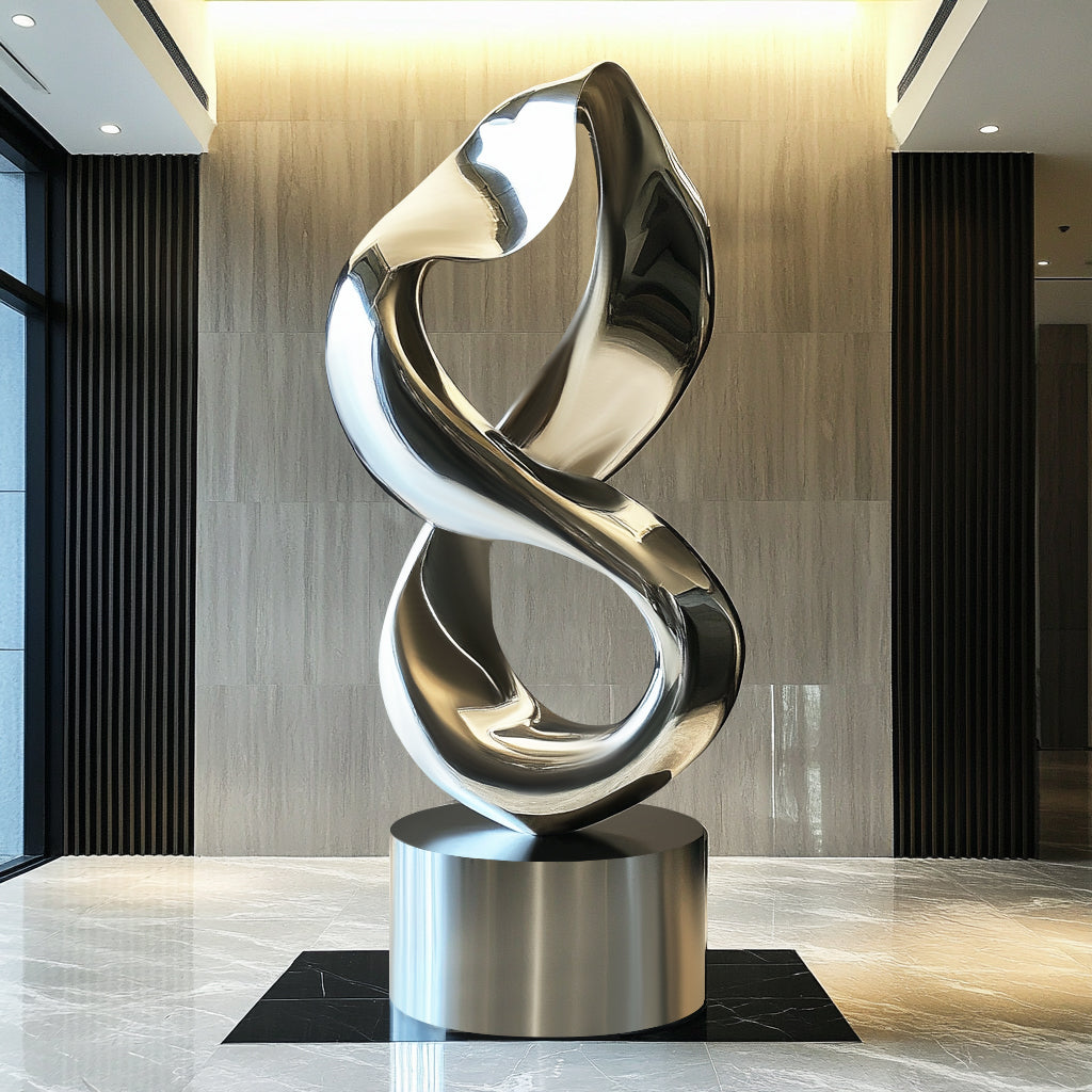 Modern abstract stainless steel infinity loop sculpture with polished finish and round base display luxury indoor