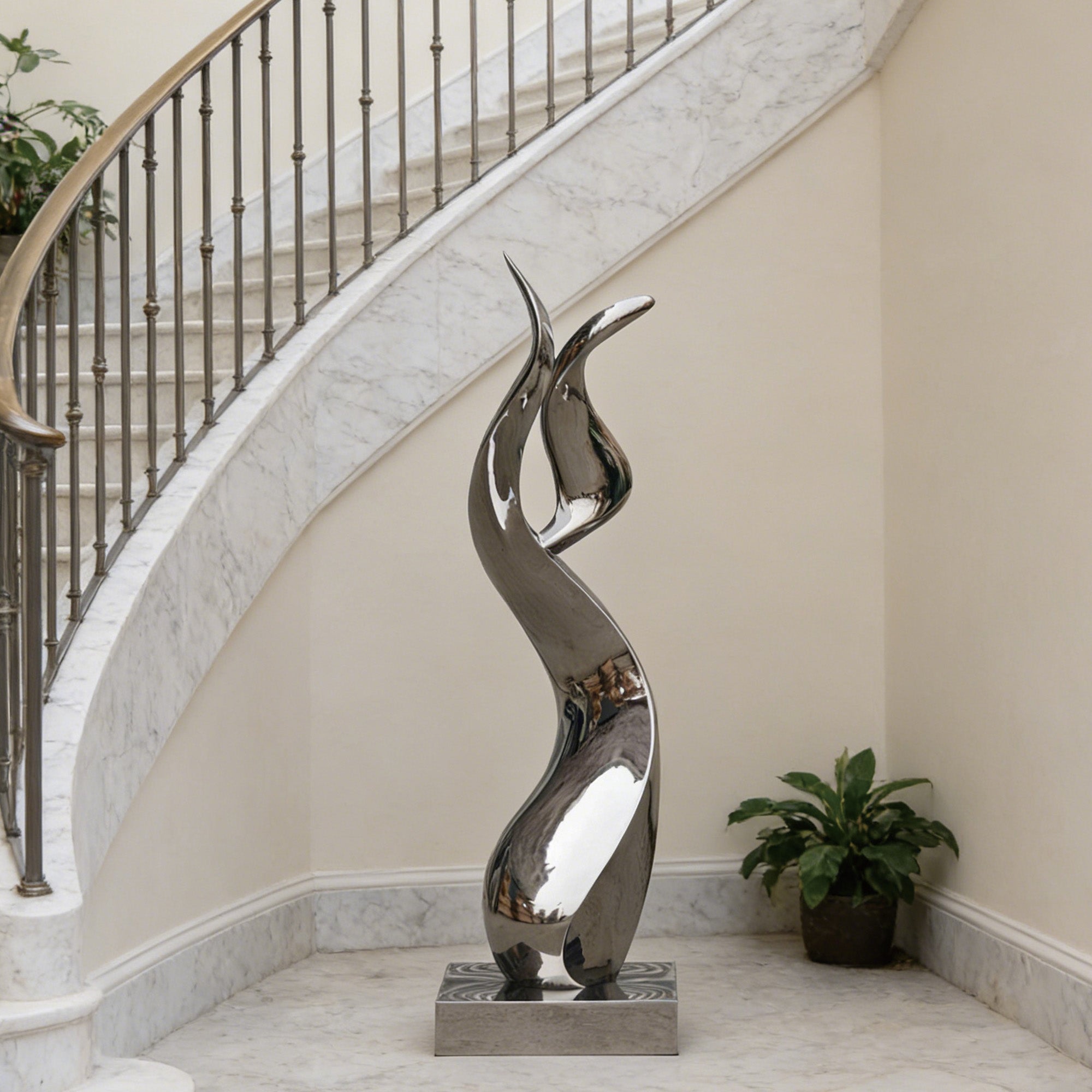 Abstract stainless steel sculpture in a reflective mirror finish, showcasing its elegant curves and striking appearance