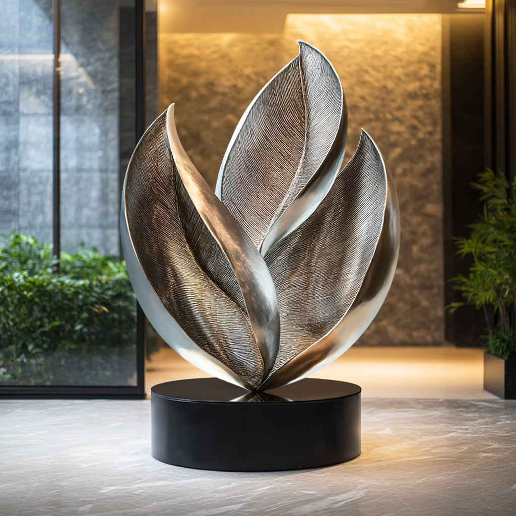 Custom Abstract Leaf-Inspired Stainless Steel Indoor Sculpture with brushed and polished finish and black base, ideal for luxury interiors and modern spaces.