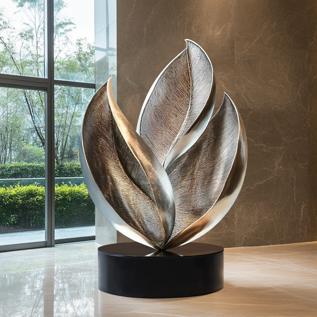 Custom Abstract Leaf-Inspired Stainless Steel Indoor Sculpture with brushed and polished finish and black base, ideal for luxury interiors and modern spaces.