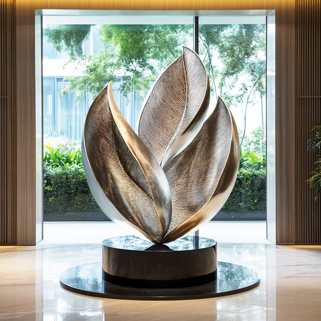 Custom Abstract Leaf-Inspired Stainless Steel Indoor Sculpture with brushed and polished finish and black base, ideal for luxury interiors and modern spaces.