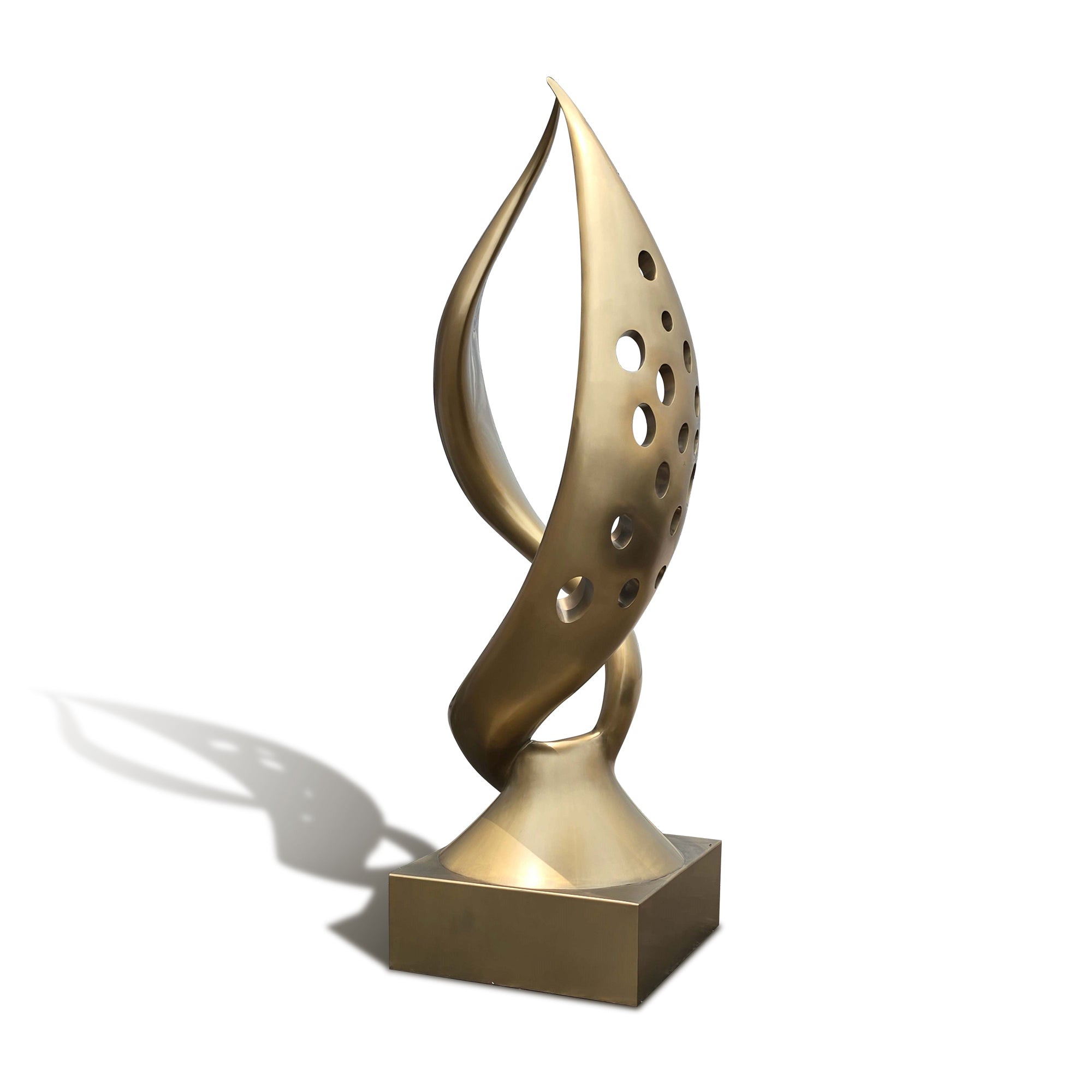 Gold abstract sculpture on a white background