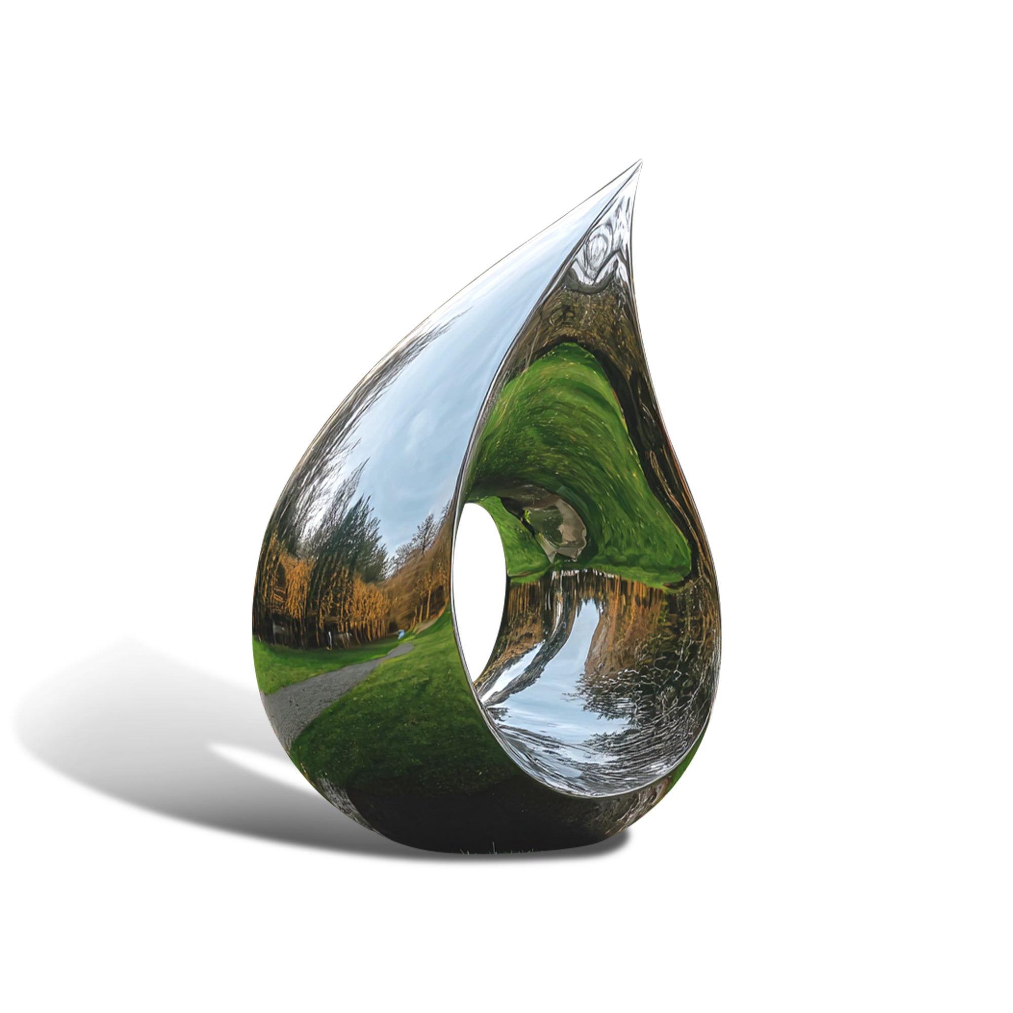 Teardrop-shaped stainless steel sculpture with reflective surface showing landscape
