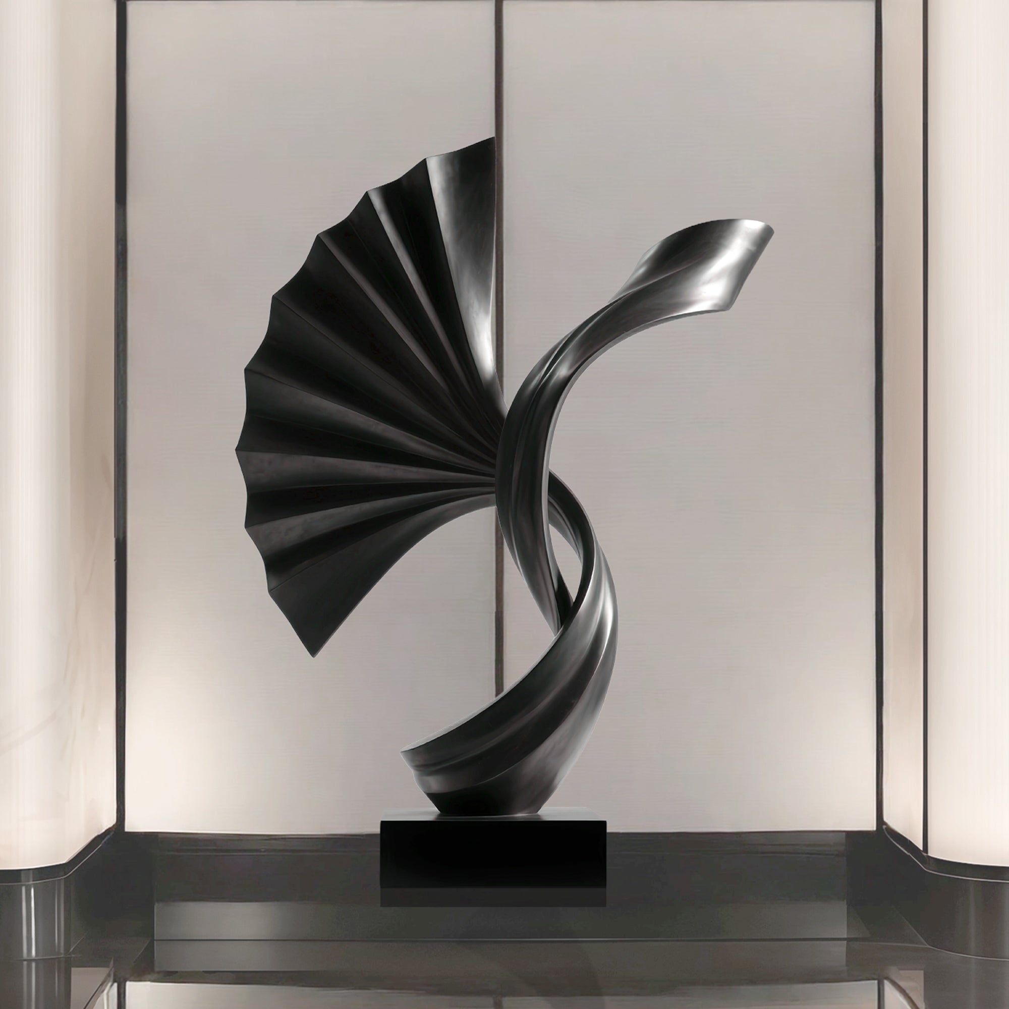 Momentum black stainless steel abstract sculpture with spiral fan form in a lobby