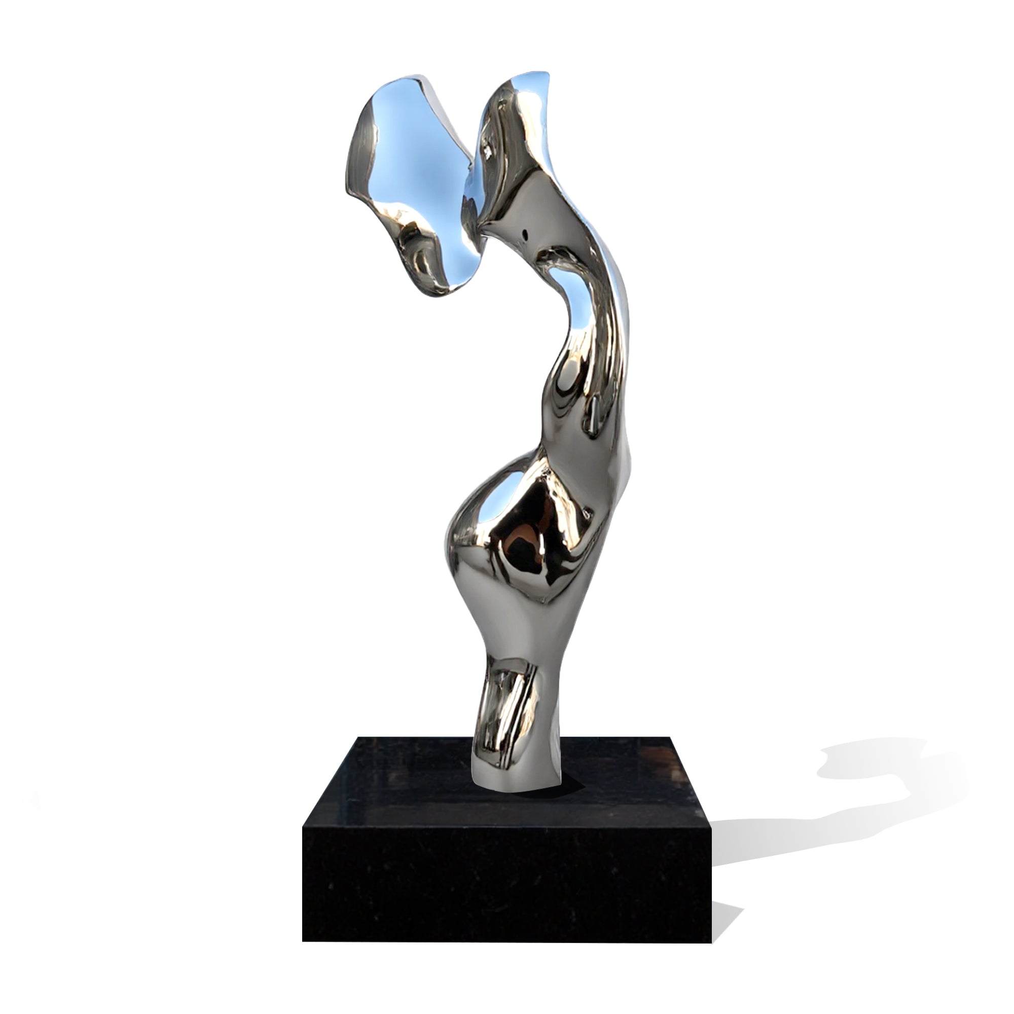 Abstract metal sculpture on a black base against a white background