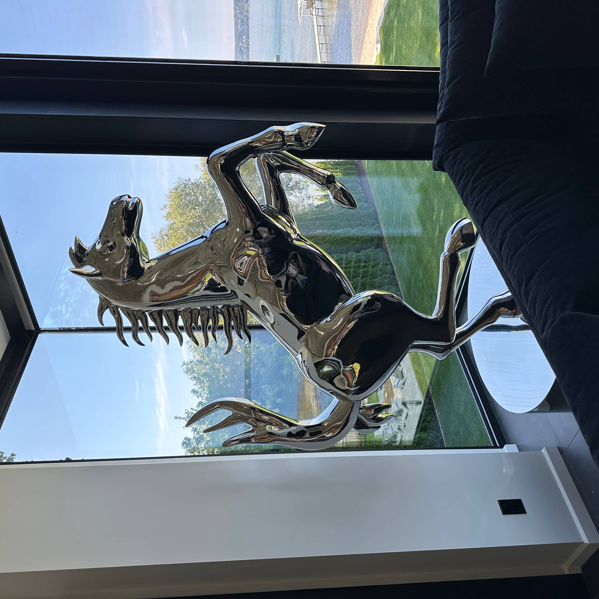 shiny rearing horse sculpture in polished electroplated steel for indoor design