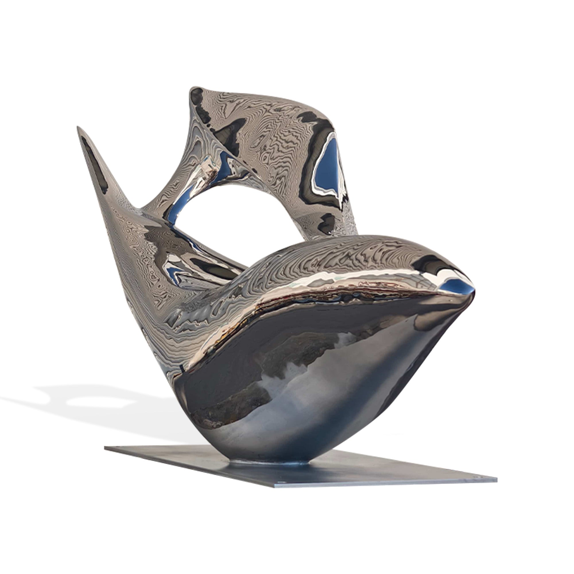 Modern stainless steel fluid form sculpture, with mirror finish and sweeping curves, captured at an angle to emphasize its dynamic, twisting shape