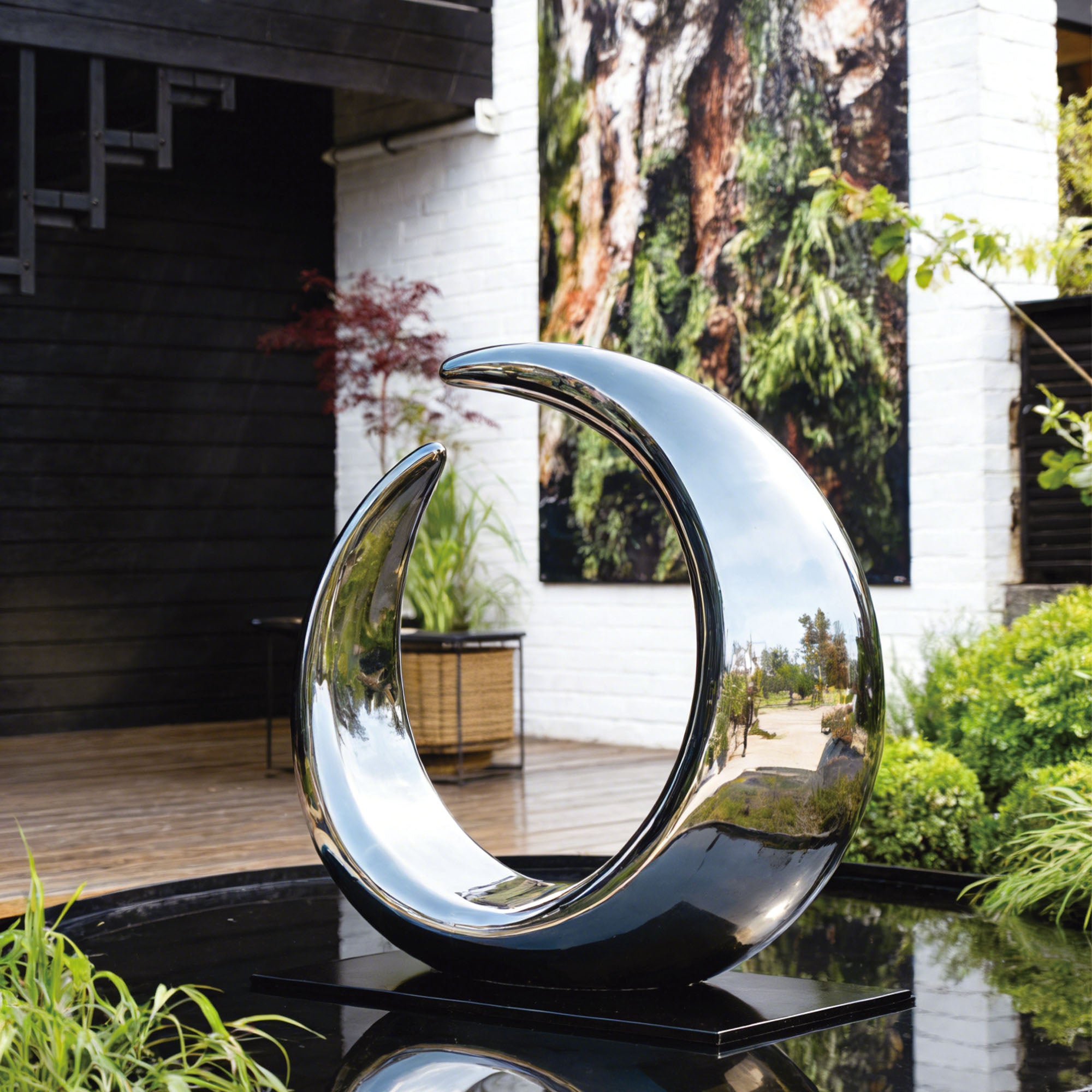 Mirror polished stainless steel abstract sculpture with sleek curves and customizable features like fountain and lighting effects, ideal for gardens and outdoor spaces.