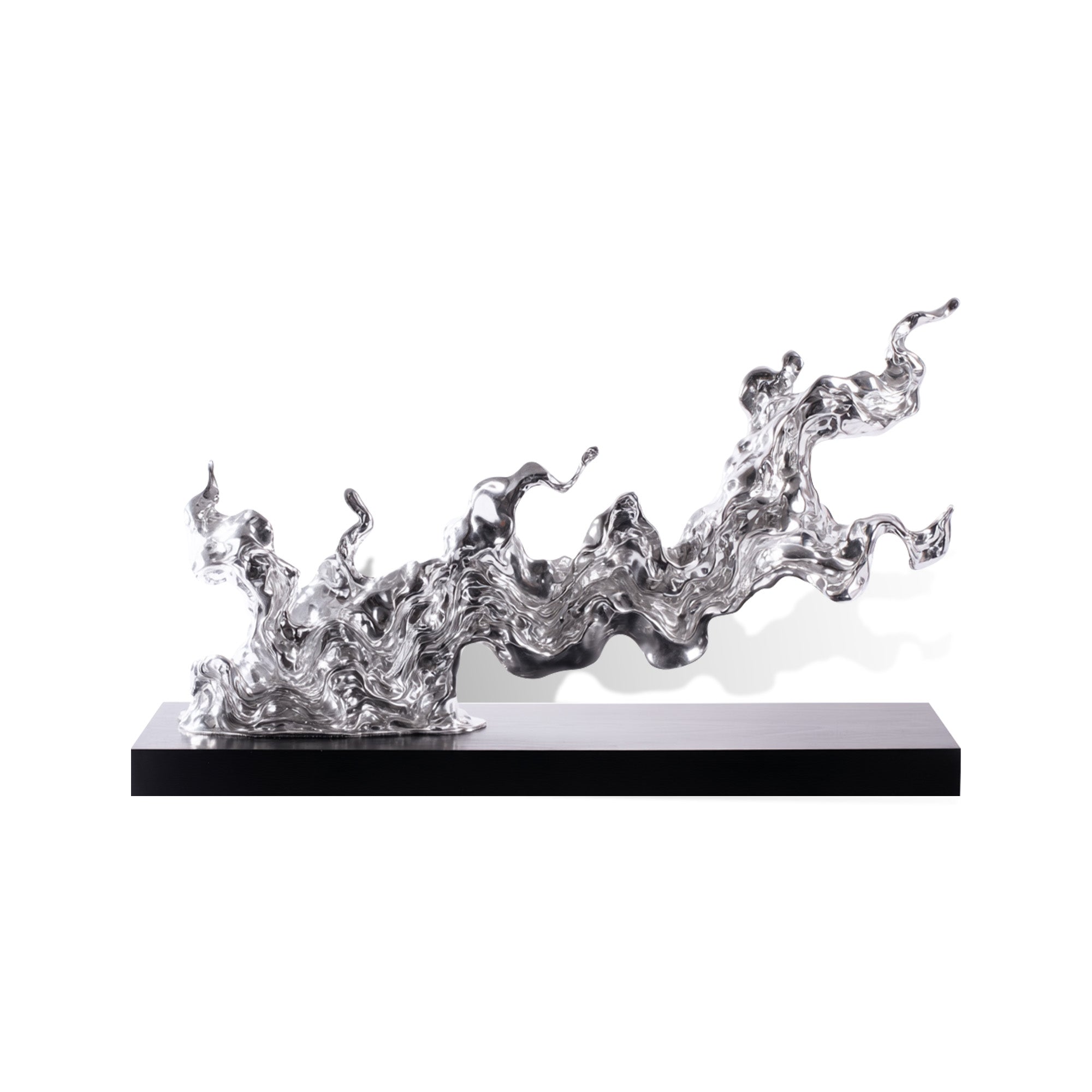Metal sculpture of flowing water on a black base against a white background