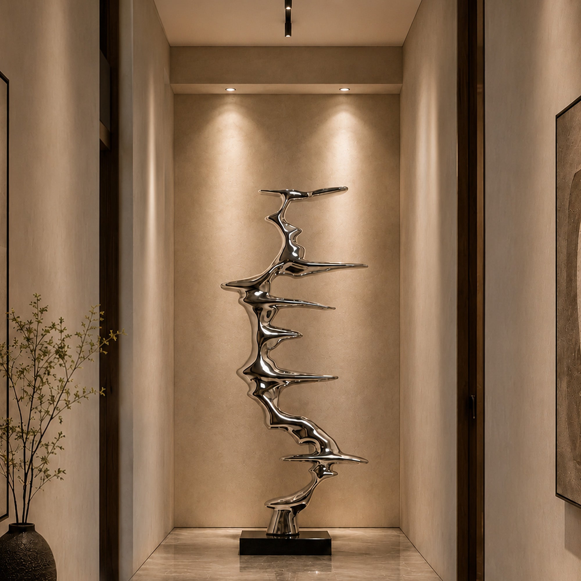 Mirror finish stainless steel abstract sculpture displayed in a luxury hallway, featuring a tall flowing metal form for modern interior decor and hotel lobby art