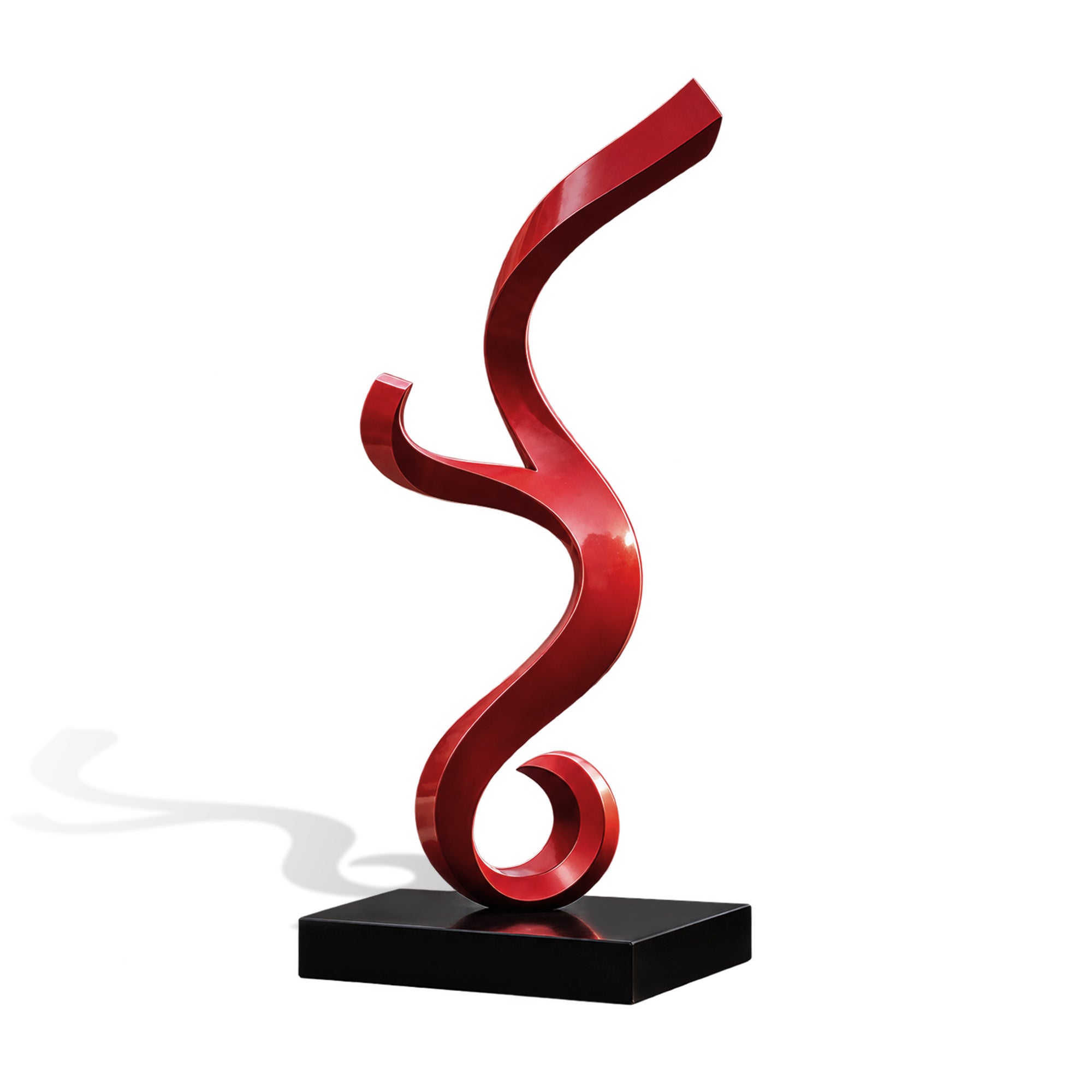 Red abstract stainless steel sculpture with a flowing curved ribbon design on a black base