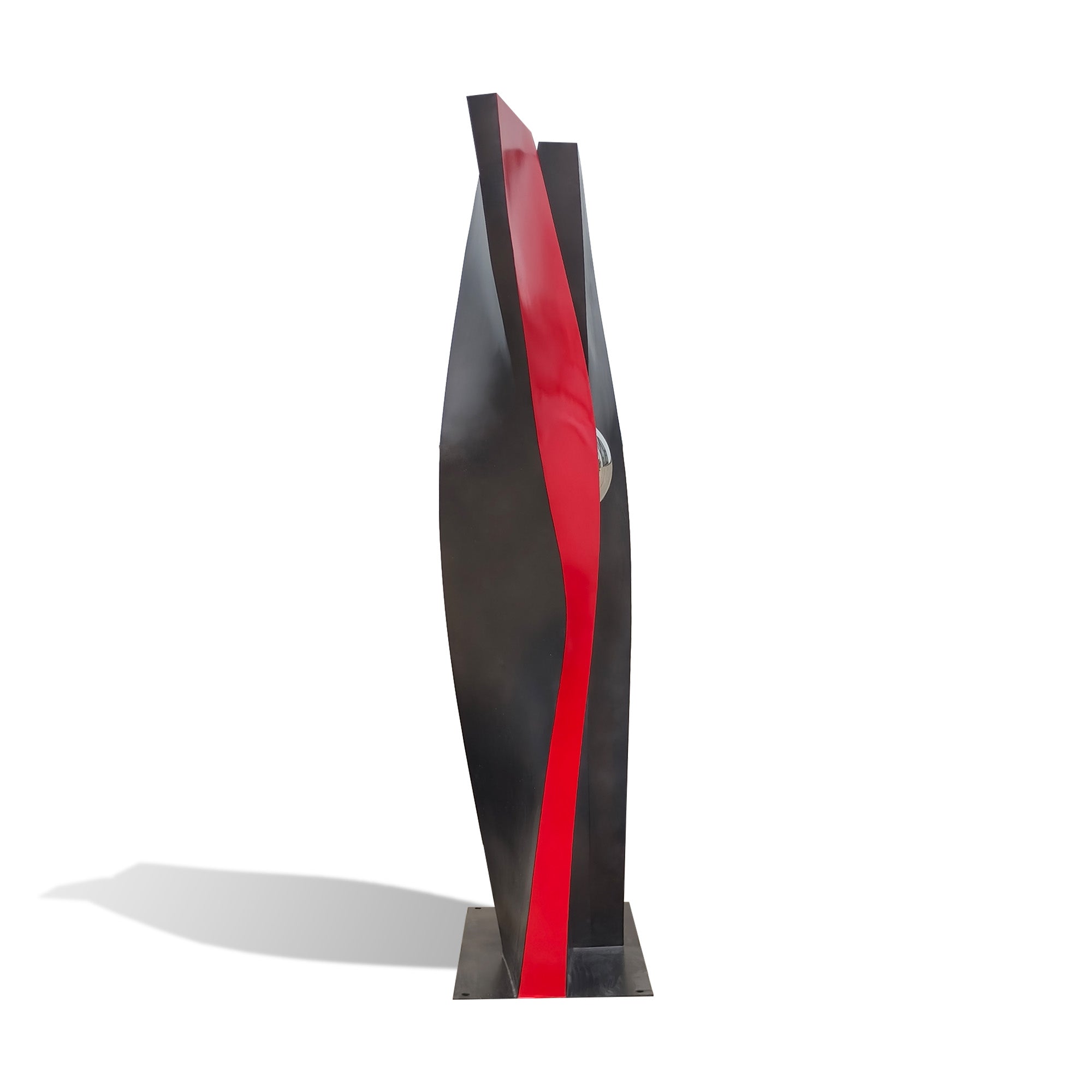 Side view of a contemporary painted stainless steel sculpture with twisted red and black vertical forms