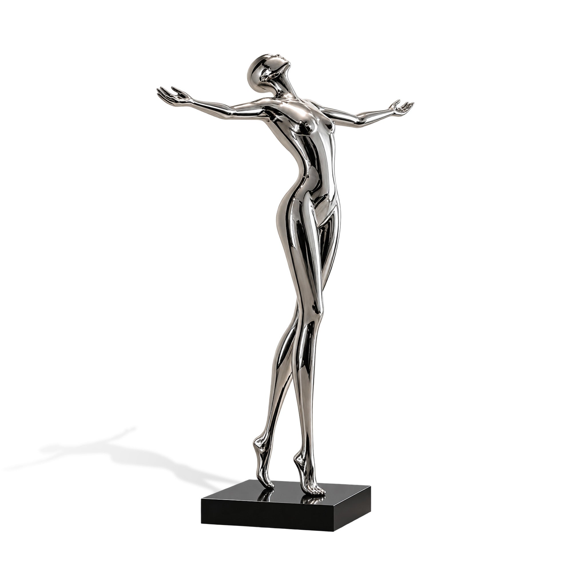 Mirror polished stainless steel futuristic figure sculpture with outstretched arms on a black base