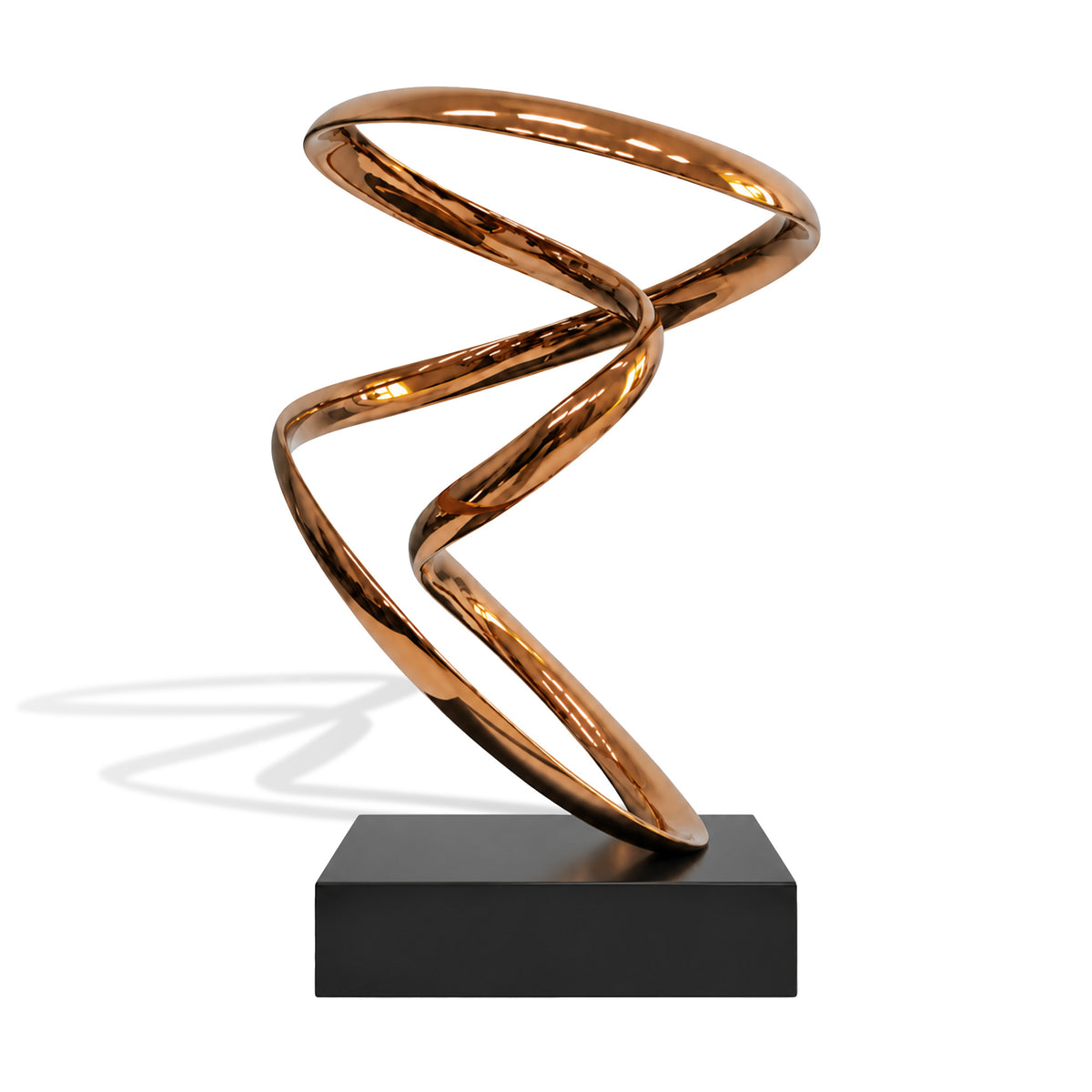 Front view of a contemporary abstract stainless steel ribbon sculpture with a brilliant mirror-polished rose gold finish. The sculpture features a continuous flowing metal ribbon forming an elongated upper loop, intersecting curves, and a dynamic twisting lower section. Its reflective metallic surfaces capture warm highlights, while a minimalist rectangular black pedestal provides a striking contrast against the clean white background.