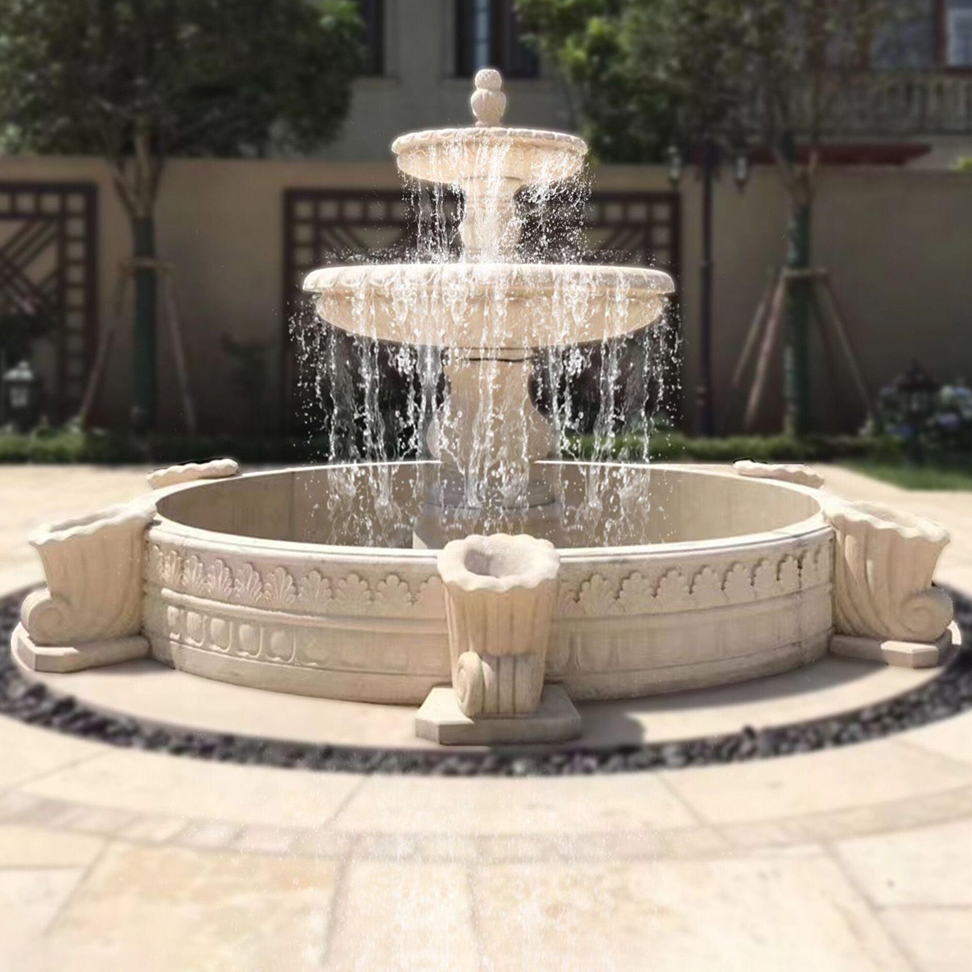 2 tiers white mrble fountain in yard