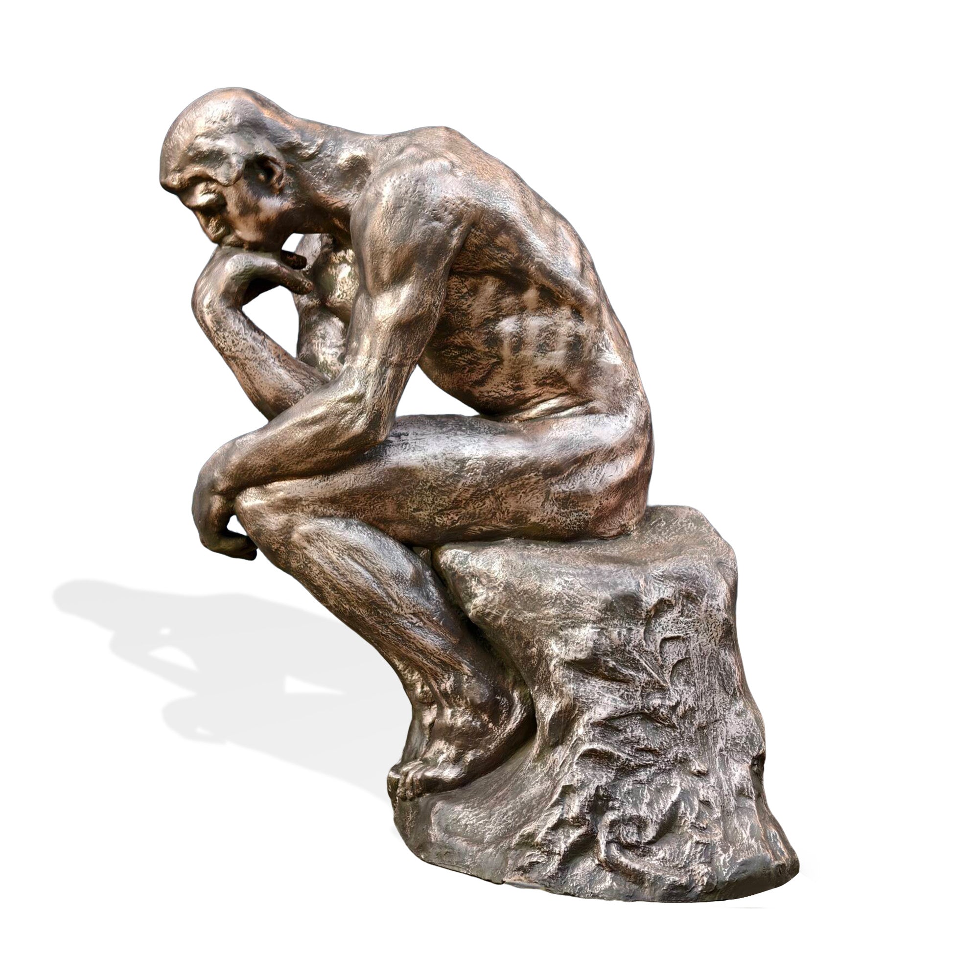 Side profile of The Thinker bronze statue replica, classic contemplative pose with detailed muscular anatomy on textured rock base.