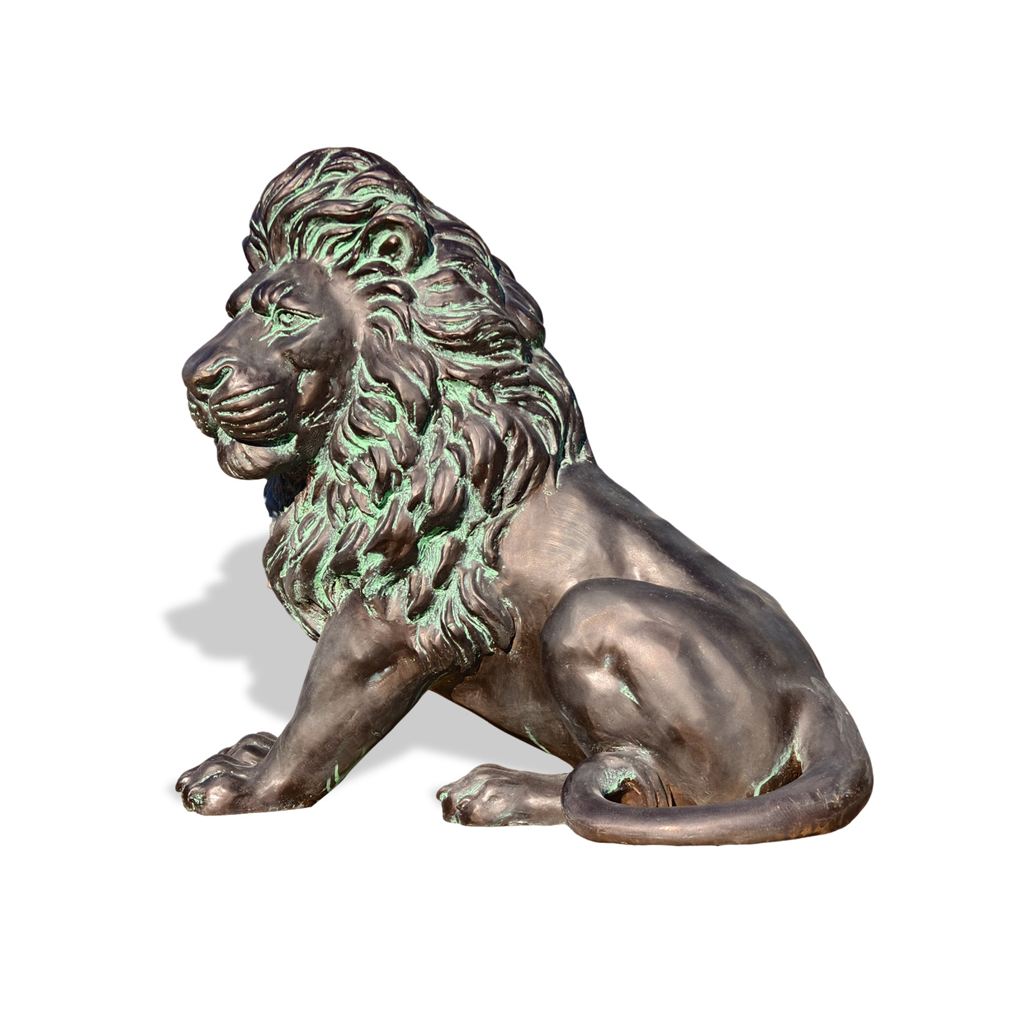 Large bronze lion sculpture outdoors, beautifully captured in sunlight.