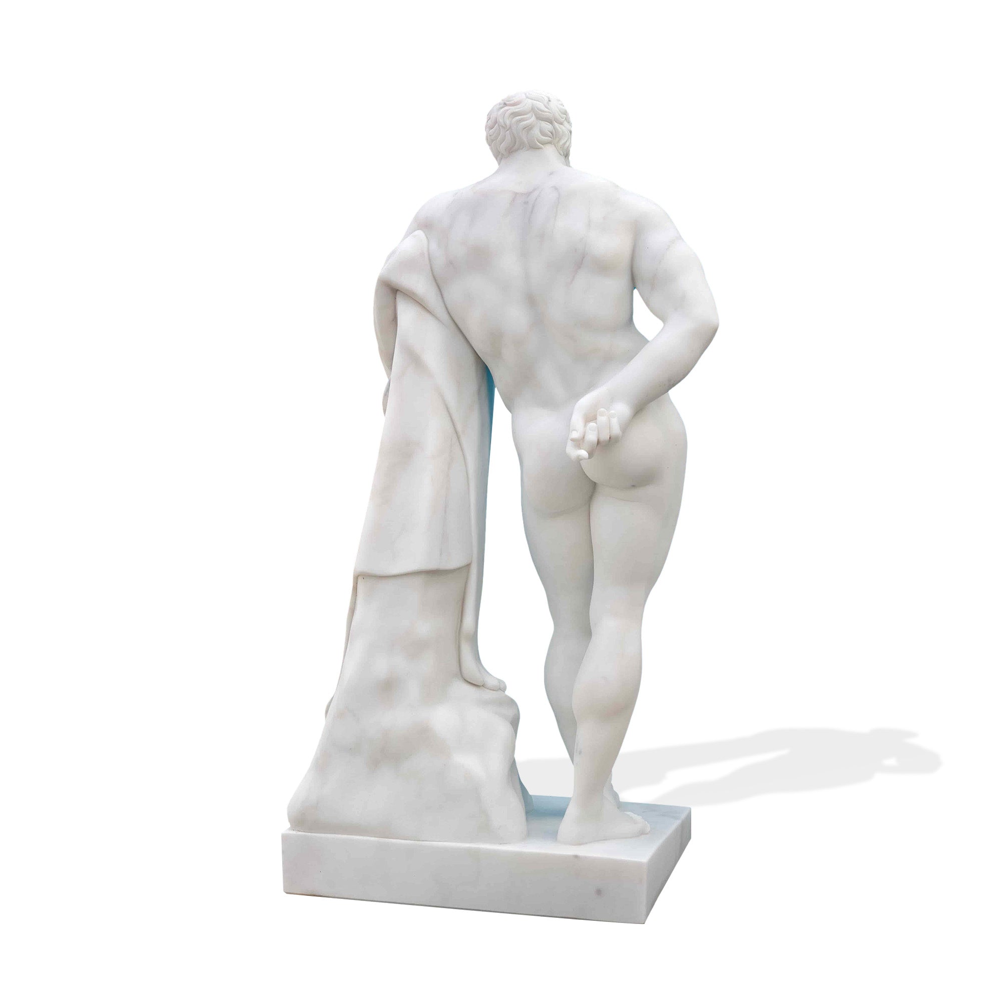 Back view of marble Hercules statue replica, showing sculpted back and legs with draped cloak, museum-style classical marble sculpture.