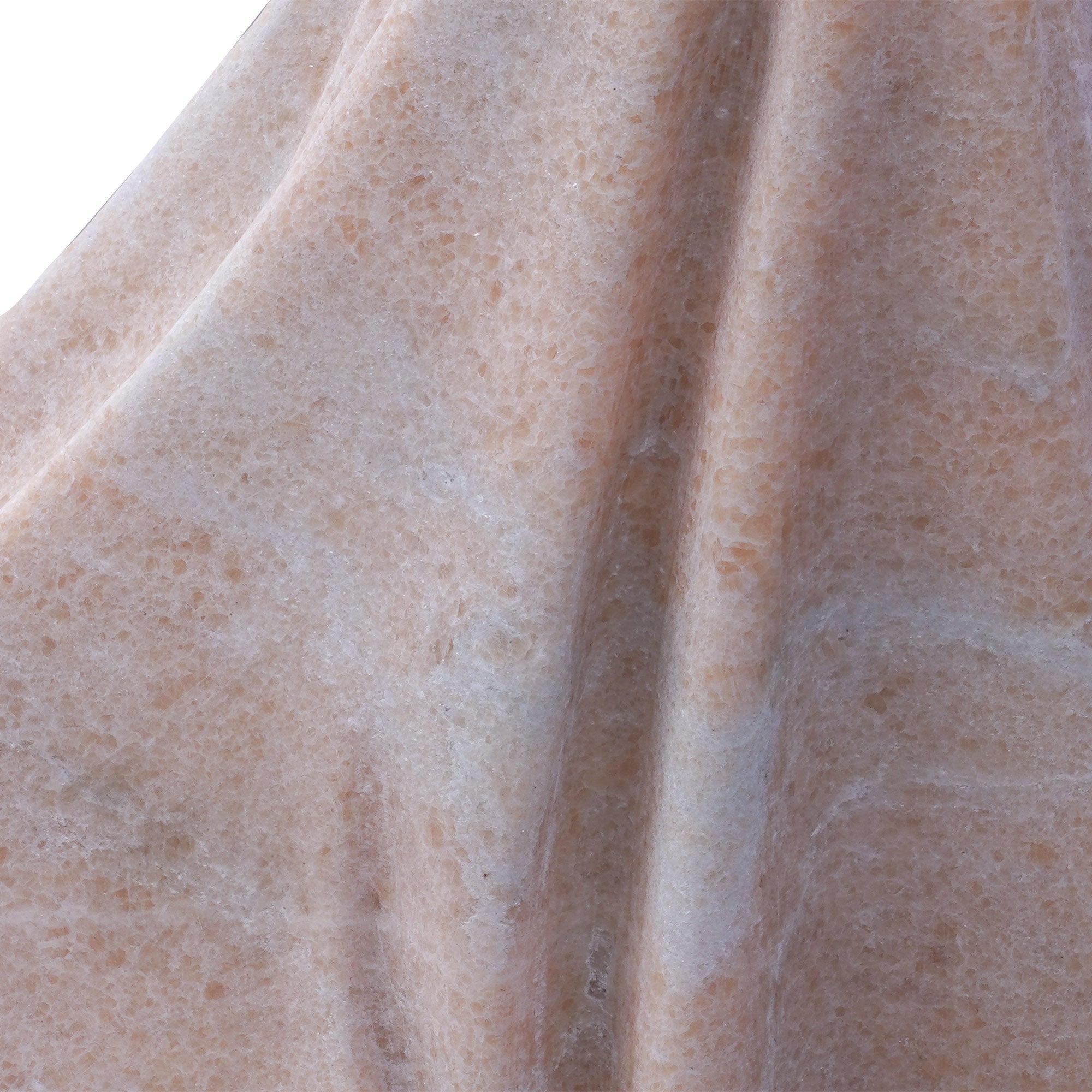 Detail of the sesame red granite drapery on the “Naked Woman” replica, revealing crystalline texture and carved folds.