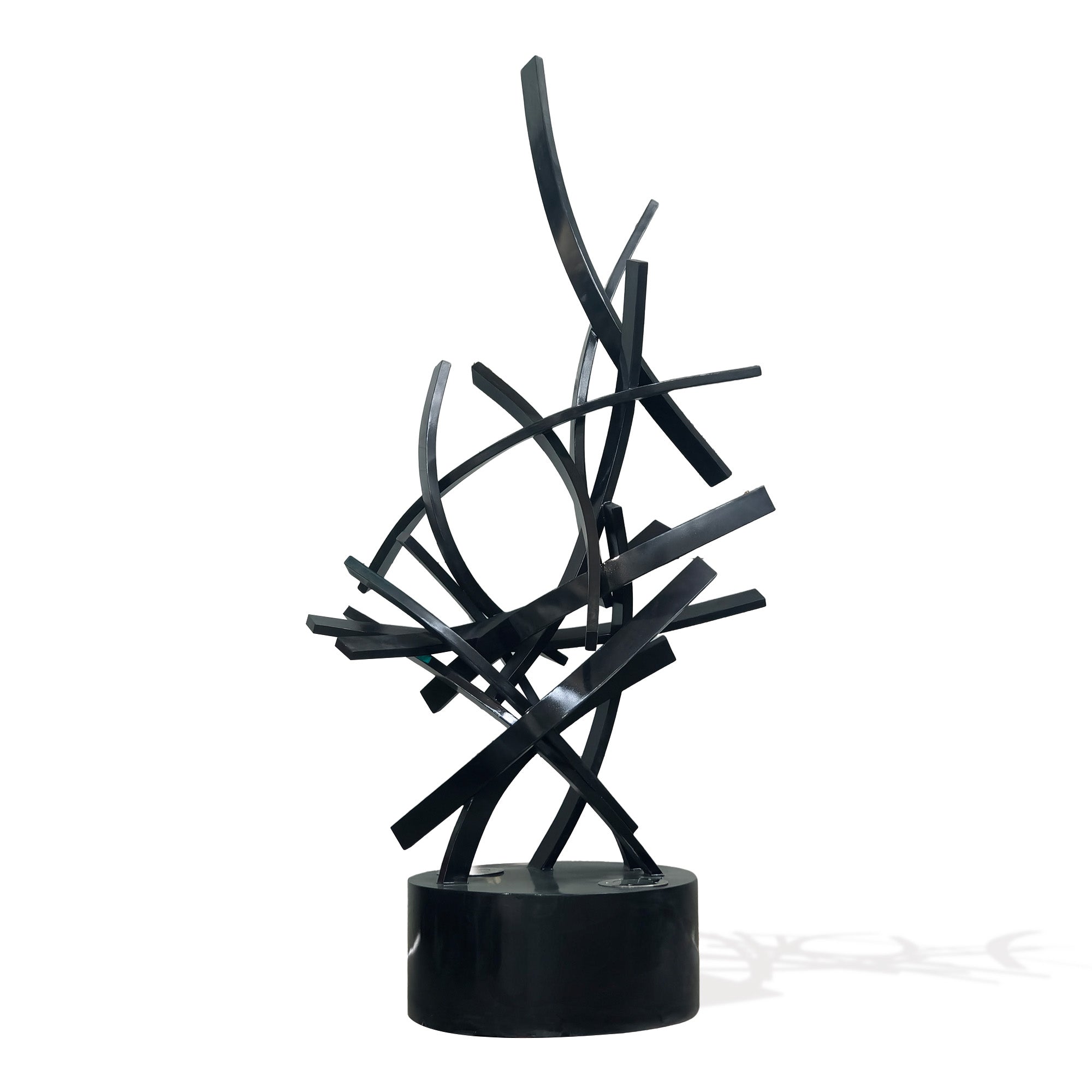 Illuminated black stainless steel abstract lighting sculpture with intersecting curved ribbons on round base, modern LED art for indoor or outdoor spaces.