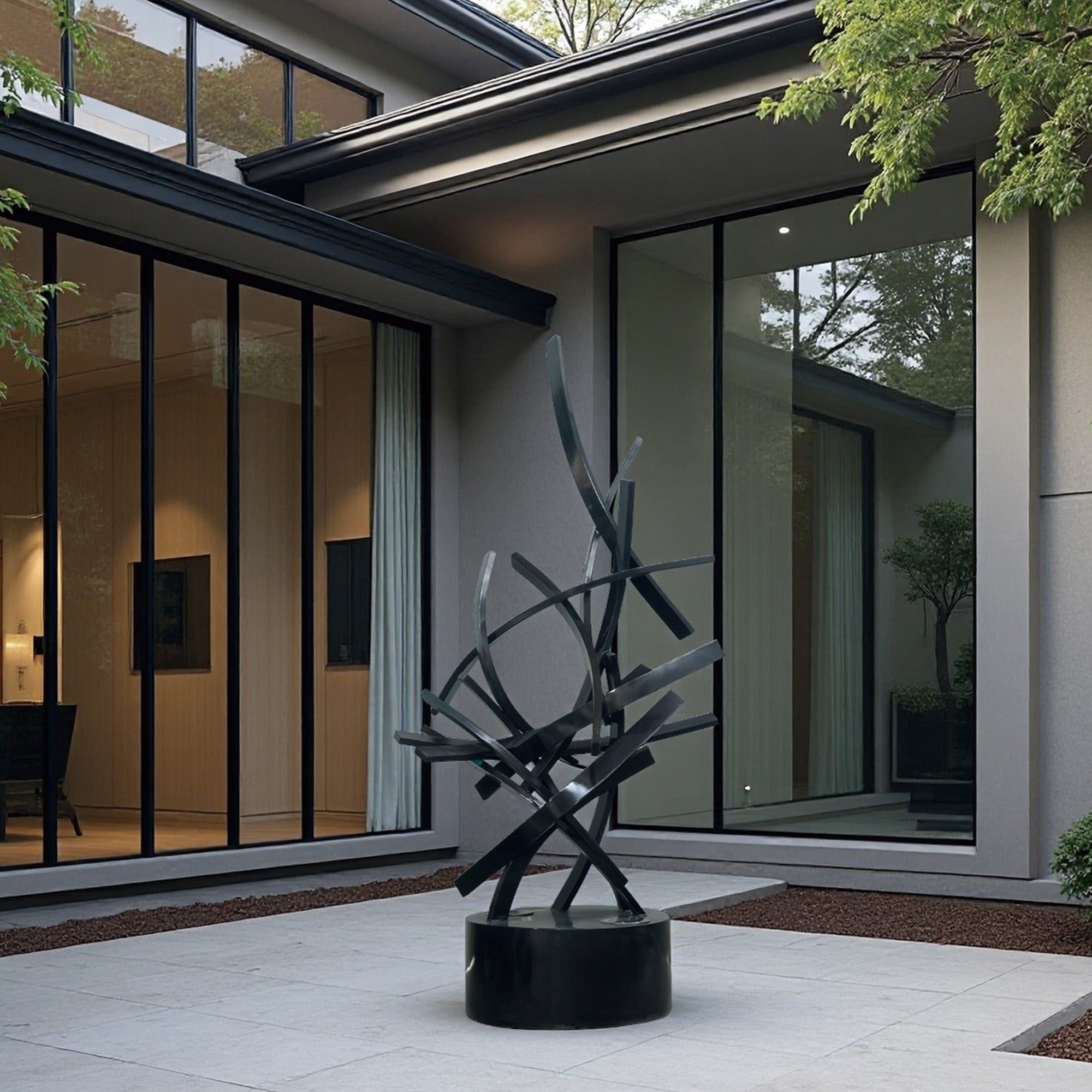Illuminated black stainless steel abstract lighting sculpture installed in a modern courtyard, luxury outdoor LED art for contemporary architecture.