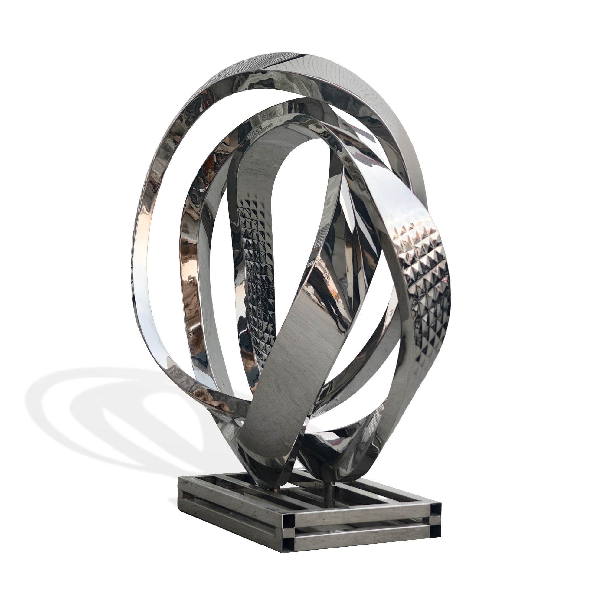 Angled view of mirror stainless steel abstract circle loop sculpture with reflective surface, large modern metal decor on base, white background.
