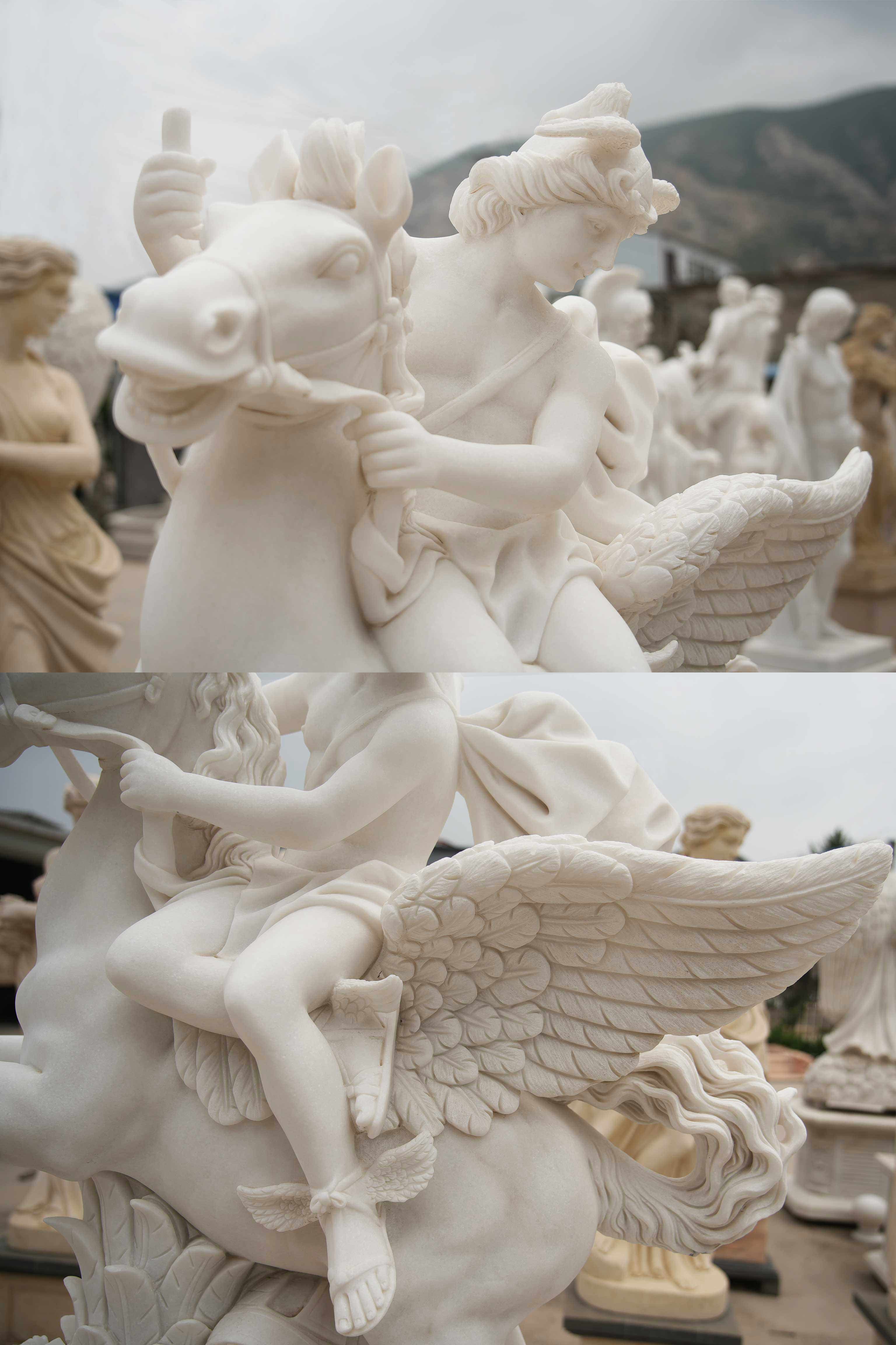 Marble statue of a mythological figure riding a winged horse, detailed with flowing robes, wings, and ornate carvings, surrounded by other classical sculptures.