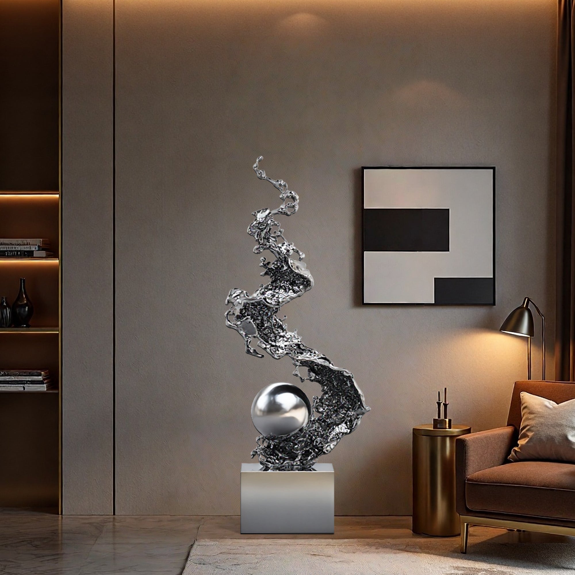 Modern interior with a silver abstract sculpture on a pedestal, a brown sofa, and a wall art piece.